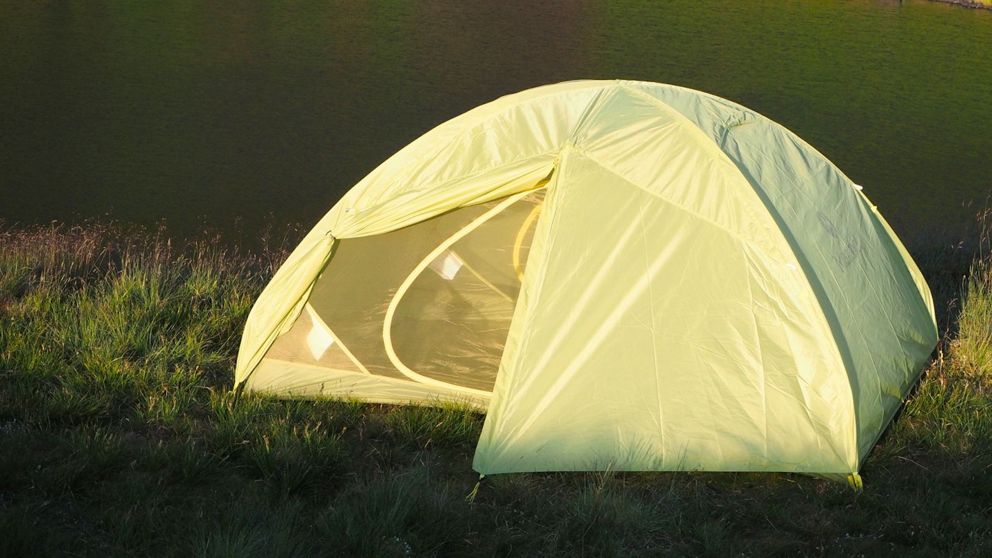 Marmot Tungsten UL 3P with a lake in the background