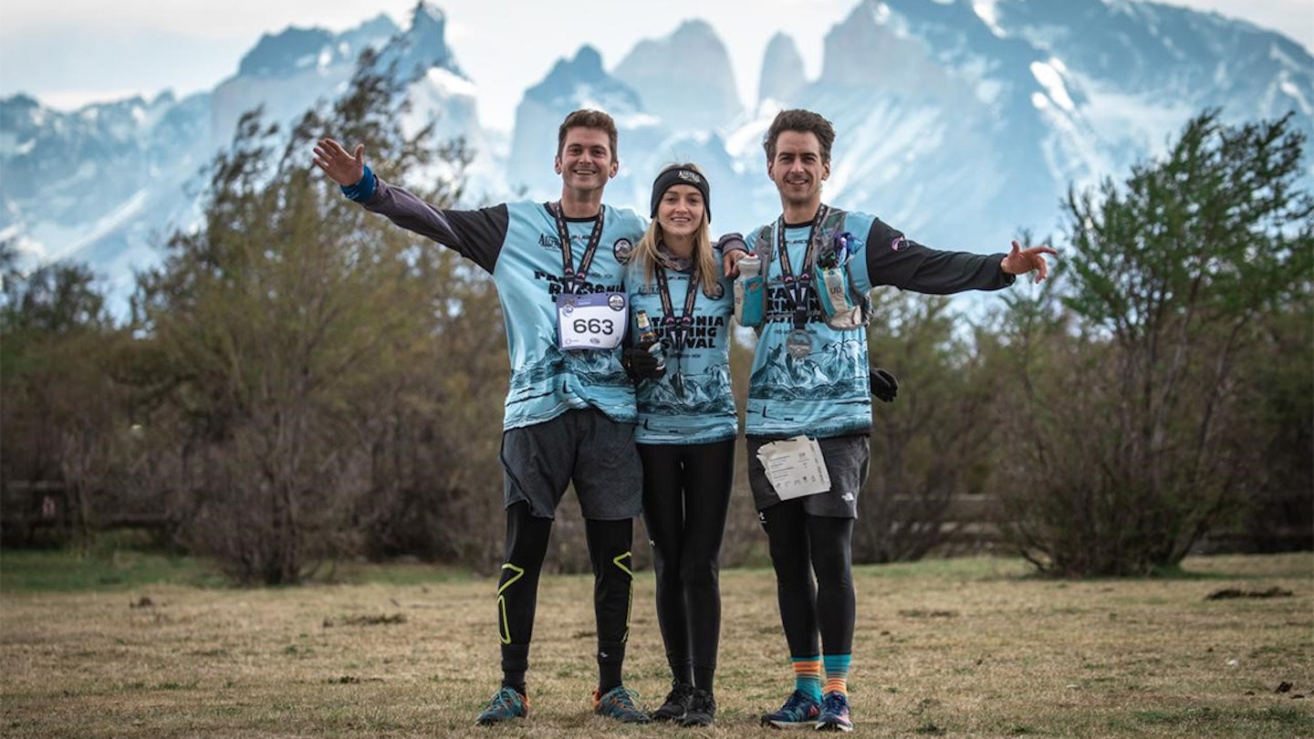 finishers posing with medals of the patagonia marathon