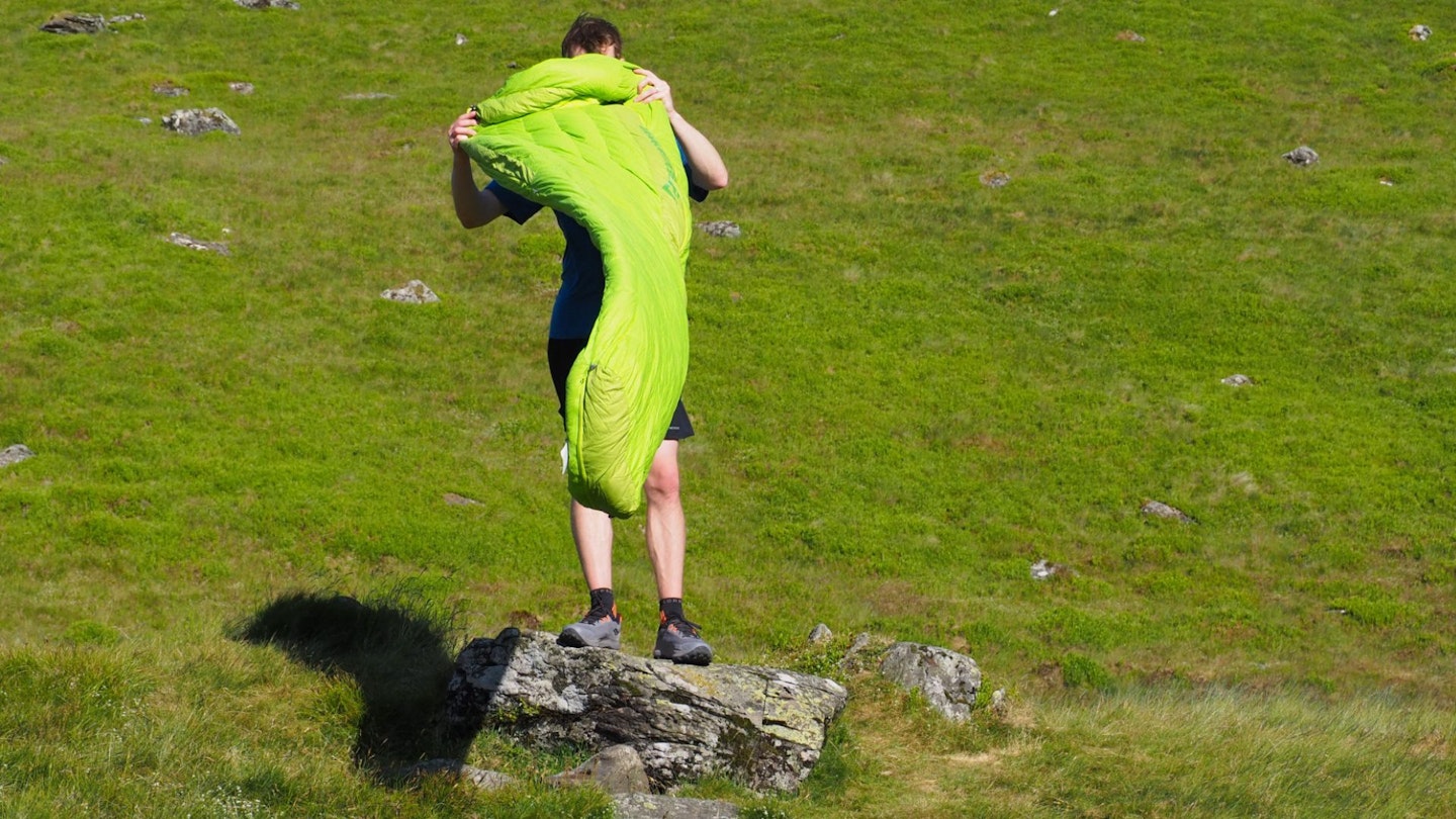 Hiker airing out a summer sleeping bag