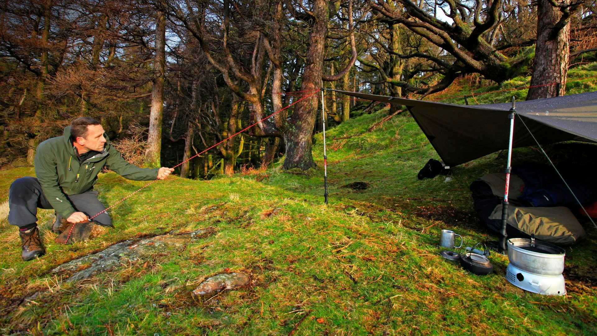 Hiker rigging a tarp