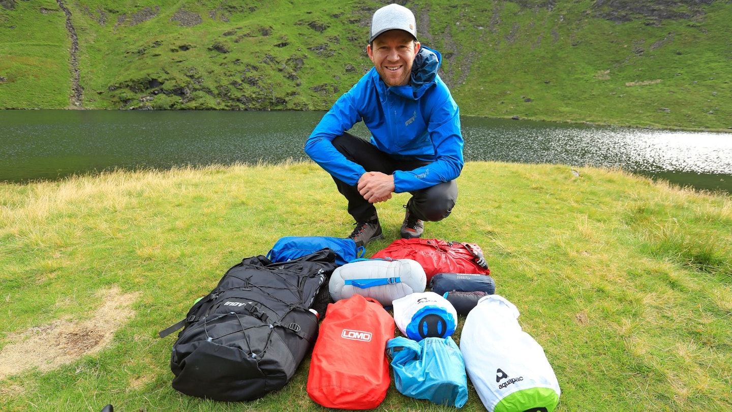 Wild camping gear laid out on the grass
