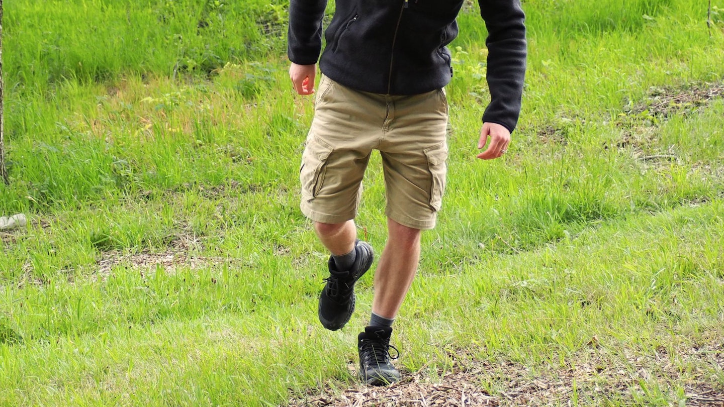 Hiker walking wearing BAM Leam Organic Cotton Cargo Shorts