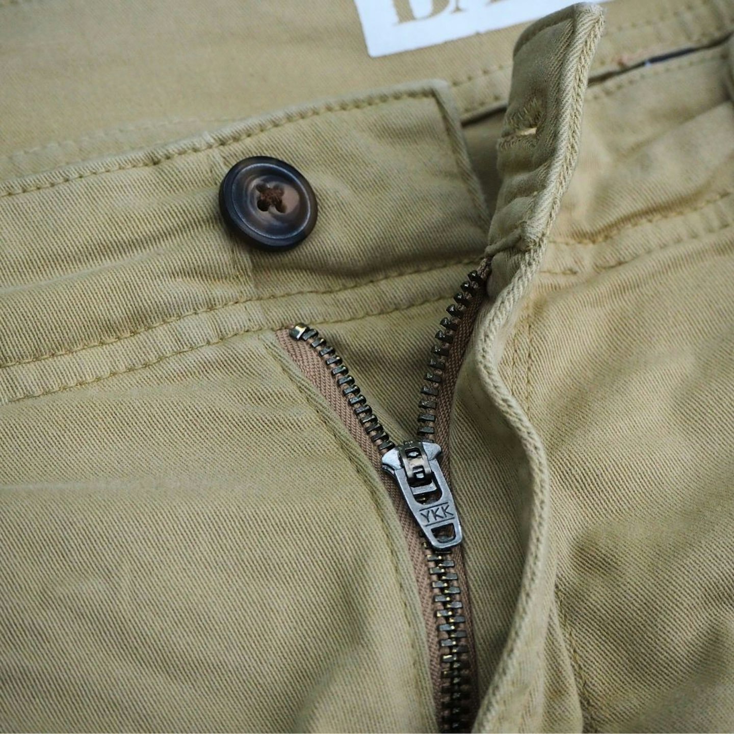 Closeup of BAM Leam Organic Cotton Cargo Shorts button and fly