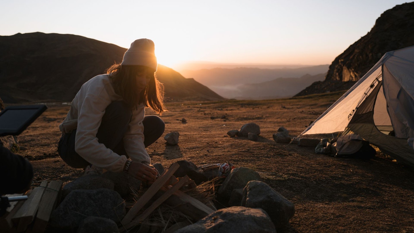 Columbia Sportwear model camping on a beach