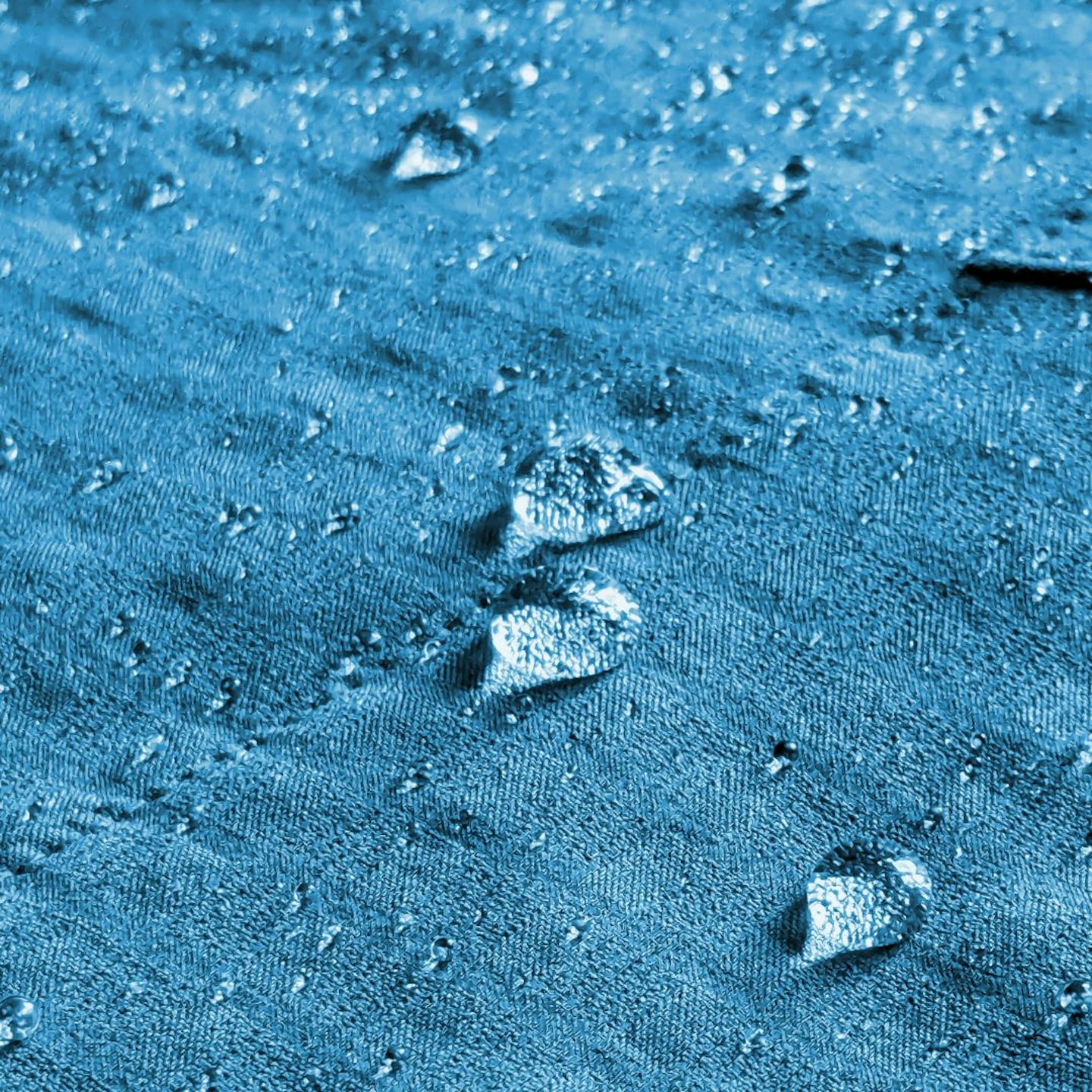 Closeup of water beading on Black Diamond Coefficient Storm Hoody fabric