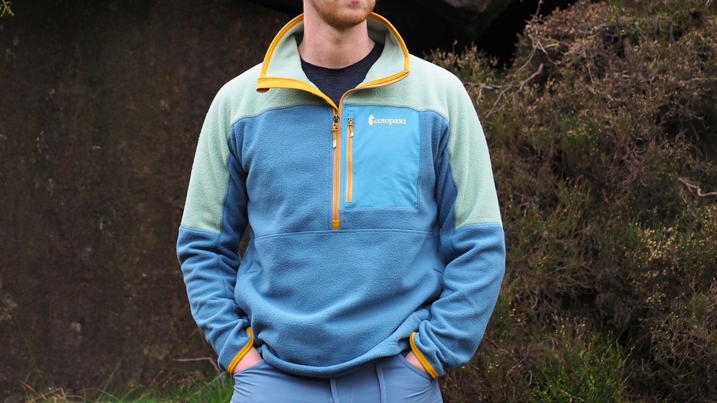 Hiker wearing Cotopaxi Abrazo Half-Zip Fleece