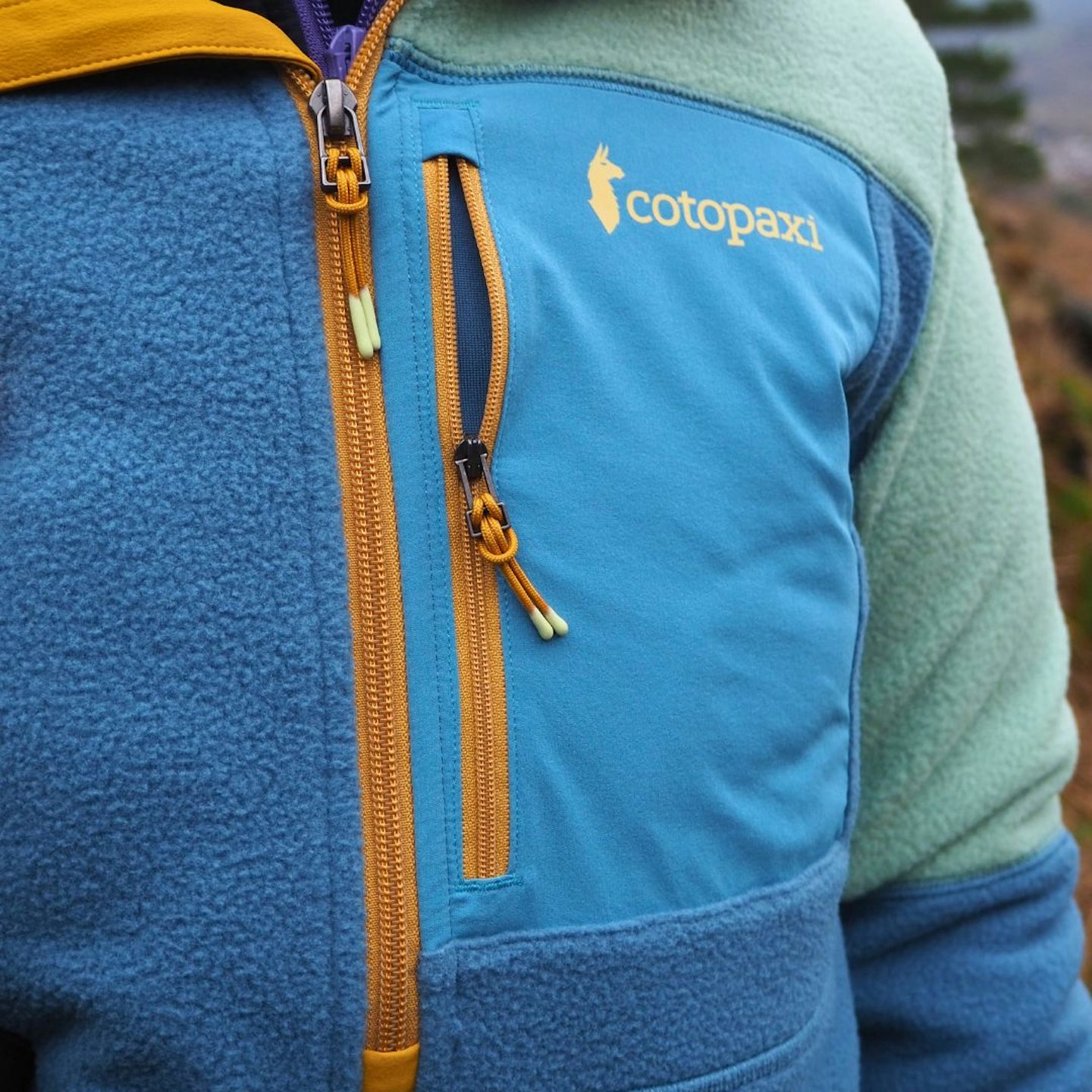 Cotopaxi Abrazo Half-Zip Fleece chest pocket