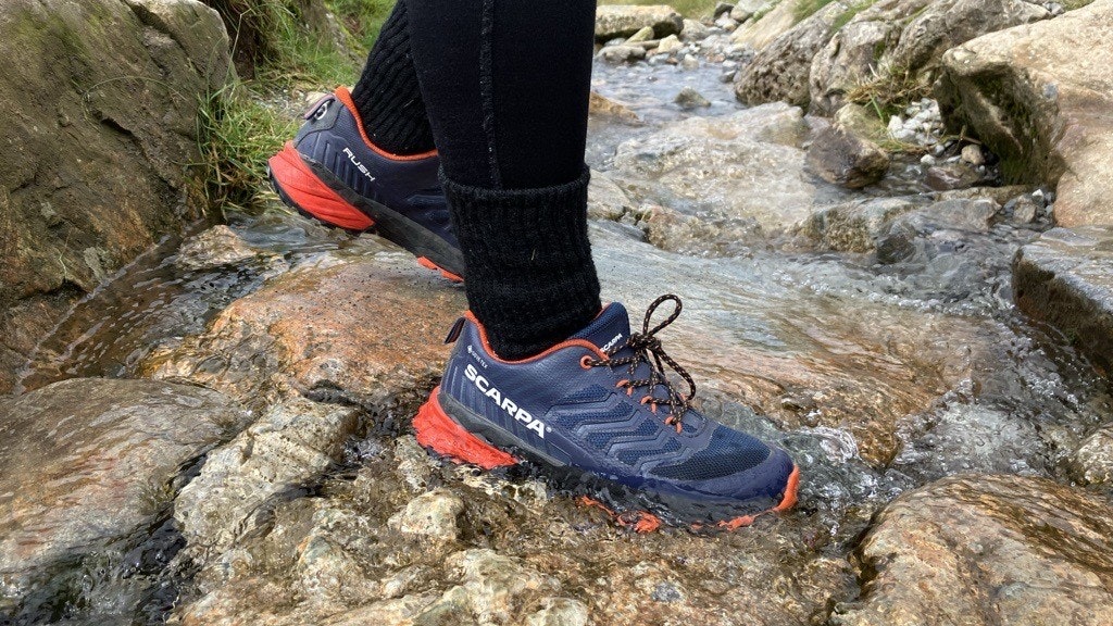 Scarpa Rush Kids GTX being worn in a stream