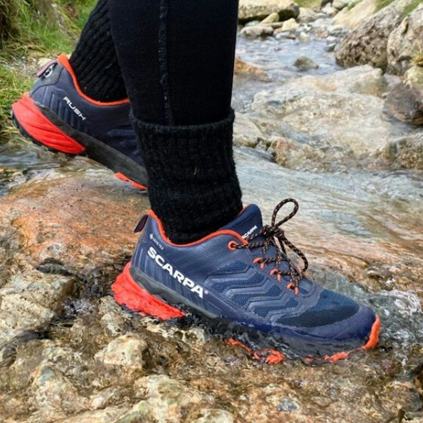 Scarpa Rush Kids GTX being worn in a stream