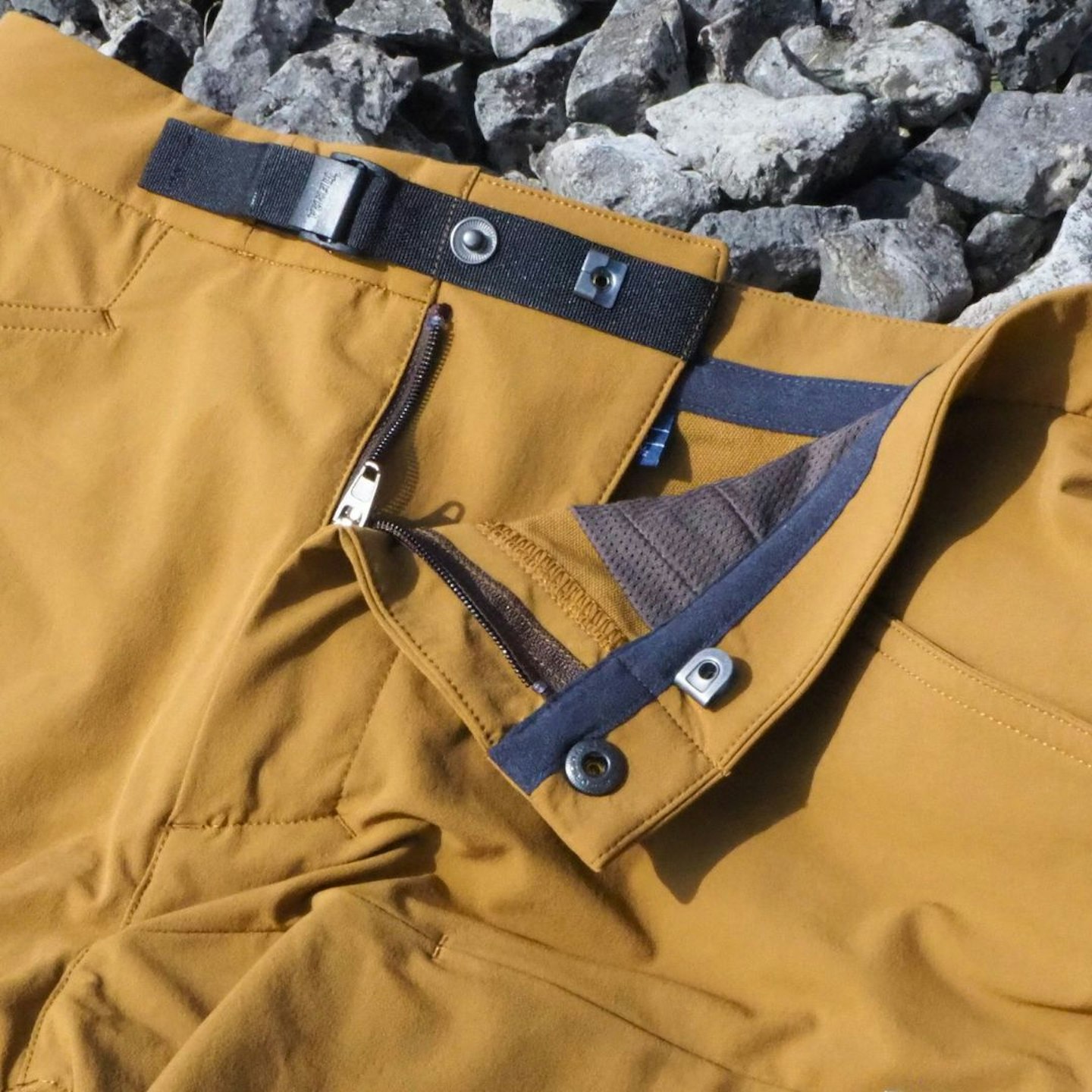 Closeup of Tierra Tarfala Shorts fly and belt