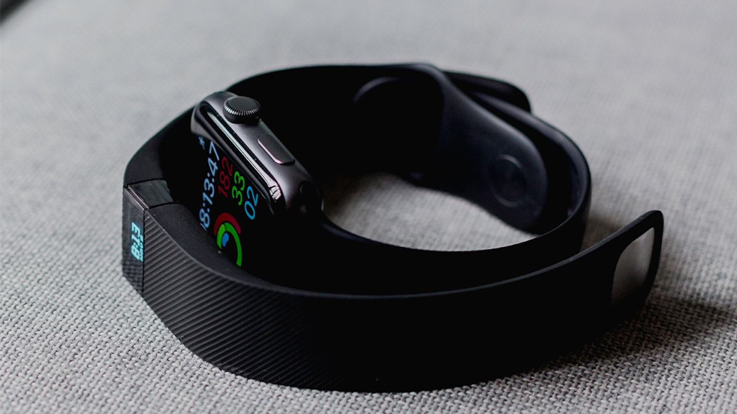 two fitness watches on a table