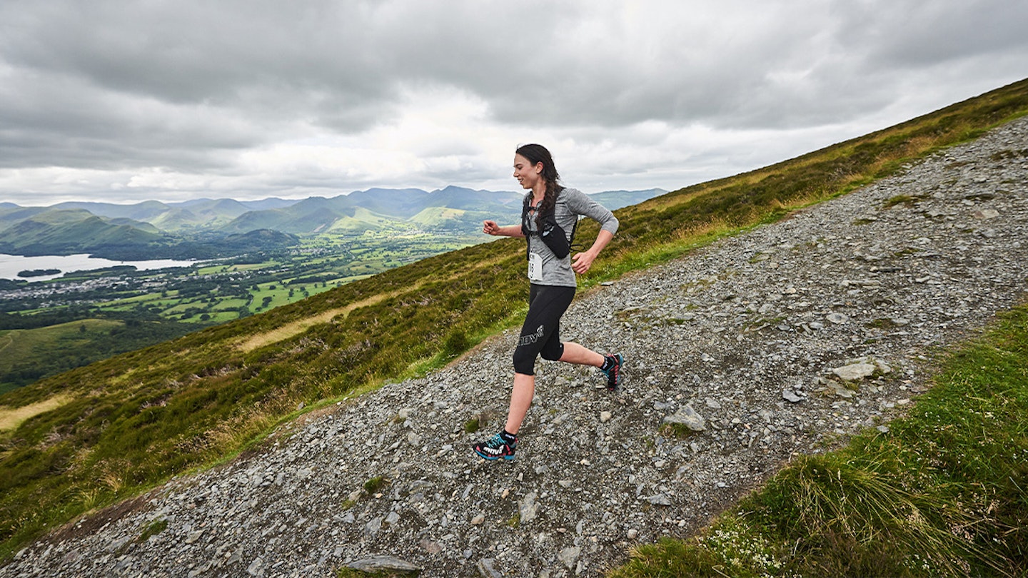 runner going downhill over slippy slate