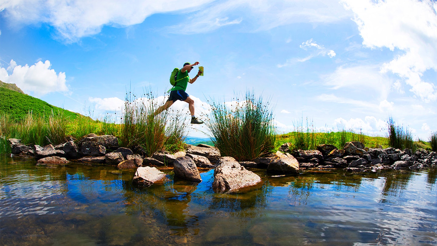 runner jumping over a puddle