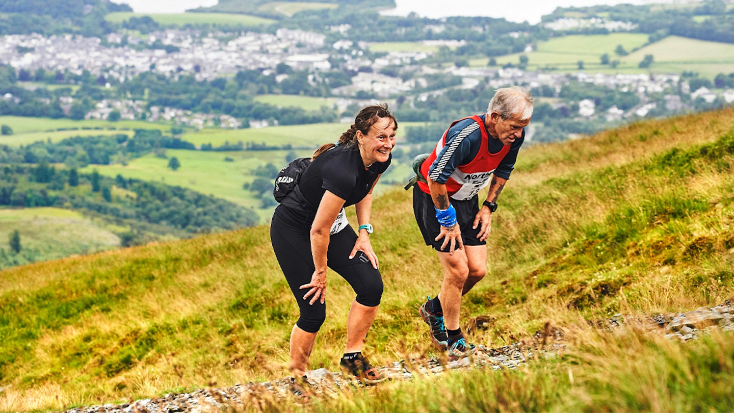 two runners going uphill