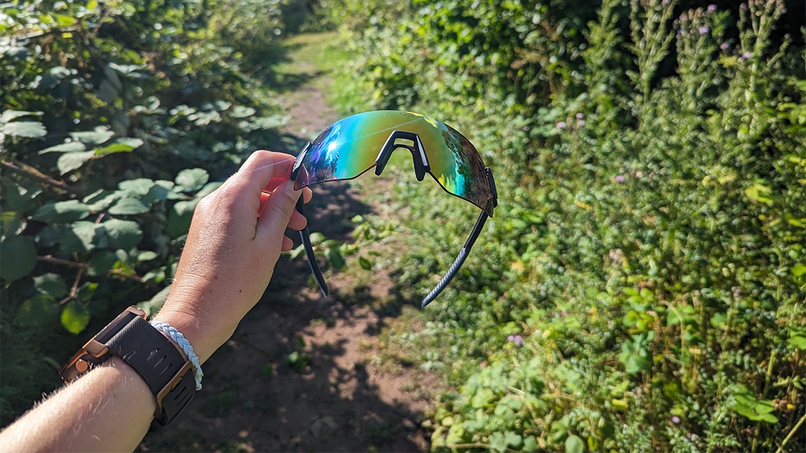 sunglasses held to the light