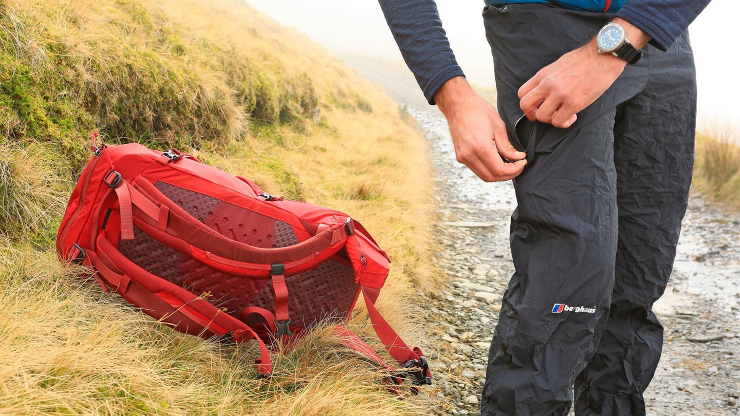 Adjusting a pair of waterproof trousers