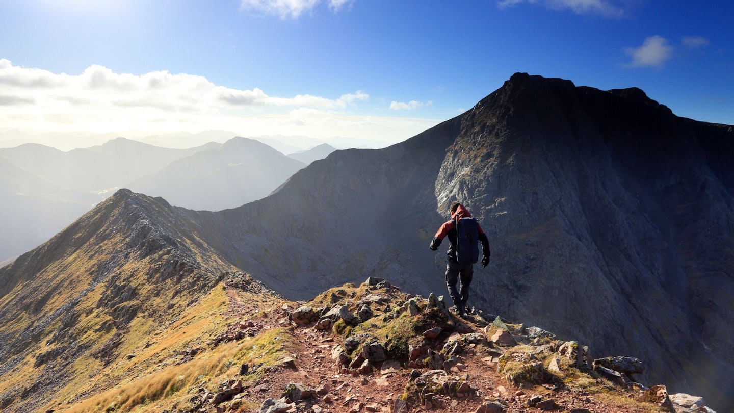 Hiker on the CMD Arete ridge heading for Ben Nevis