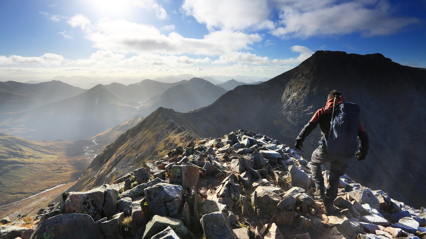 Walker descending towards the start of the CMD Arete