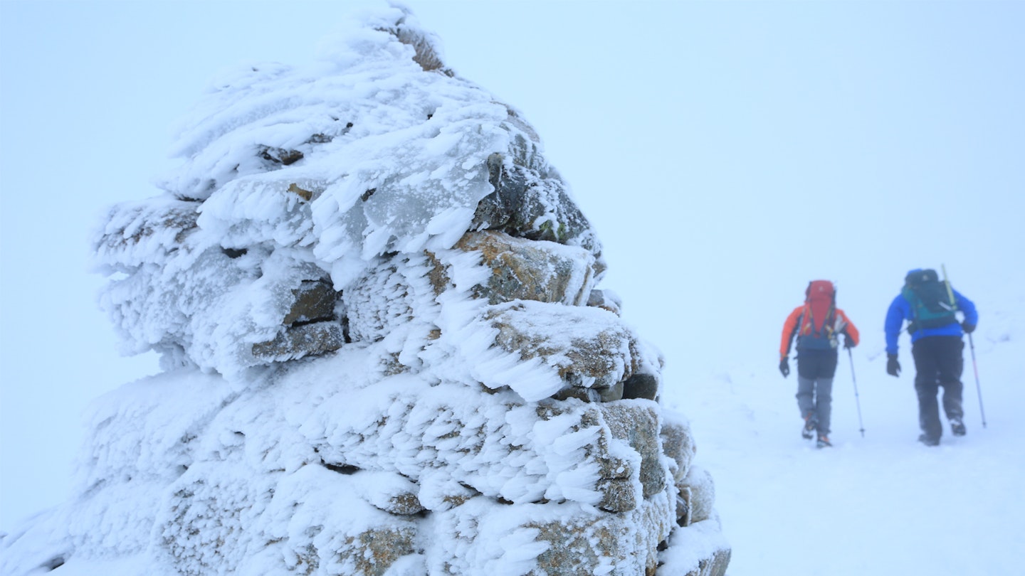 Leaving the summit of Ben Nevis in the snow