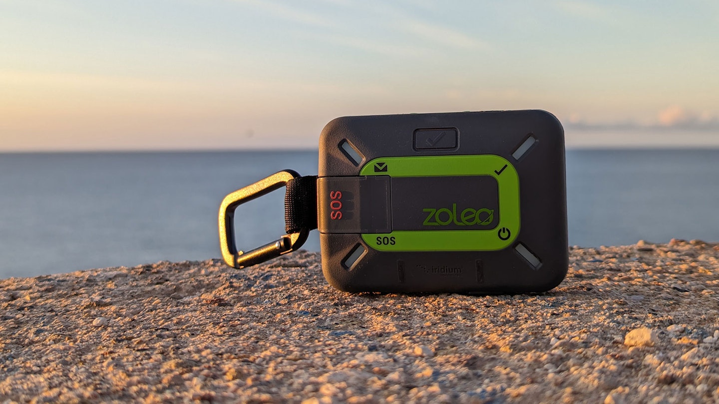 Zoleo satellite communicator device on a rock in the sun