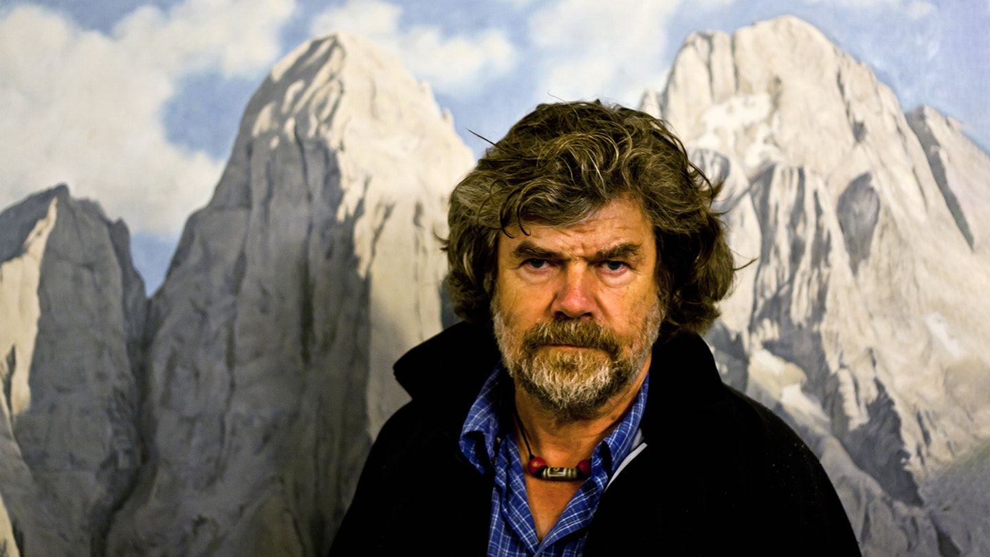 Reinhold Messner in front of some serious mountains