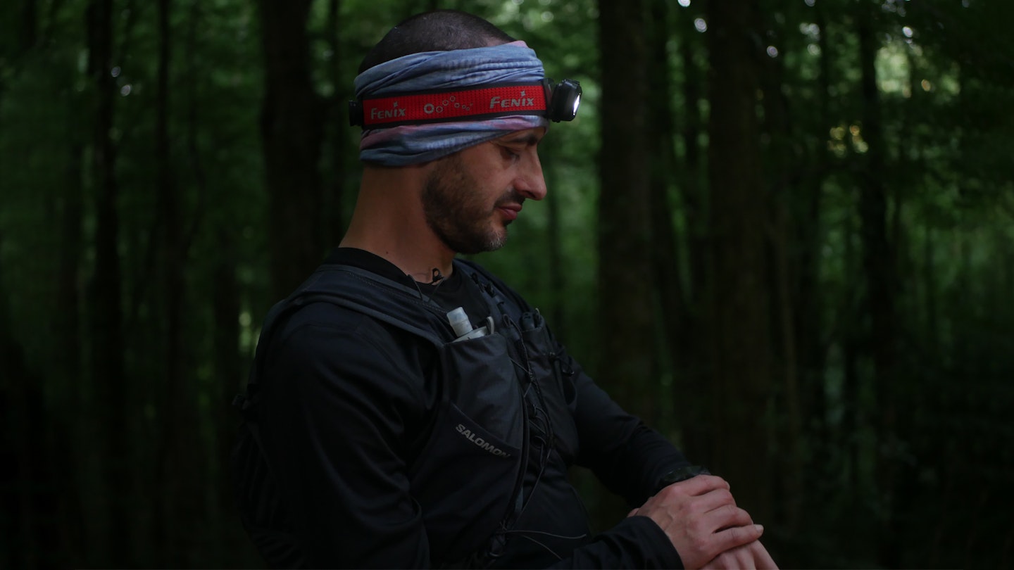 Trail runner wearing fenix headlamp