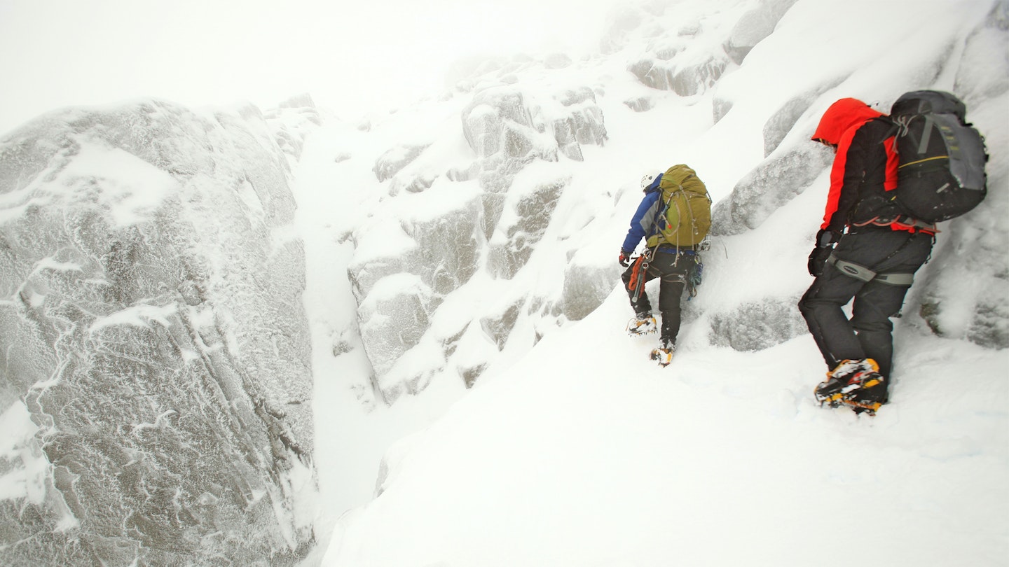 Winter walking with crampons and backpacks in Snowdon