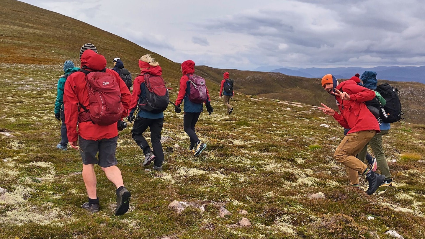 Group of hikers wearing Gore-Tex ePE jackets walking up a hill