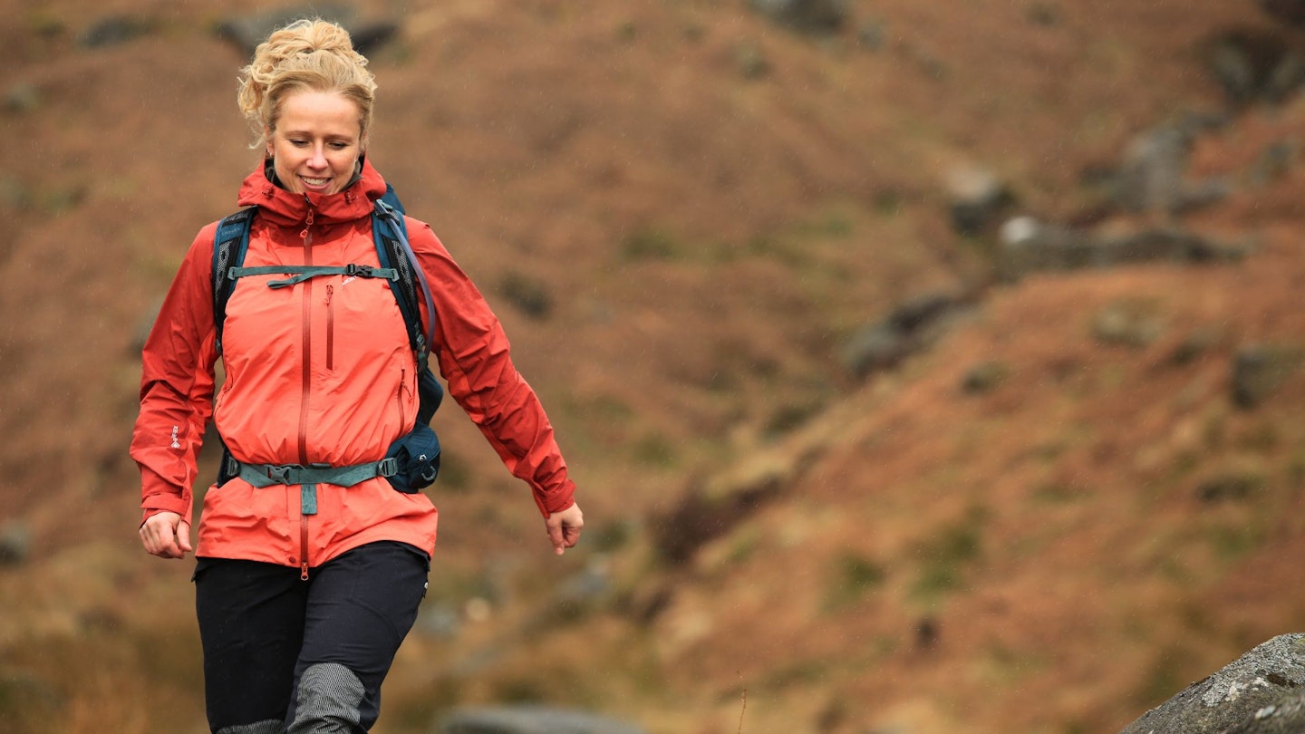 Hiker walking in a waterproof jacket