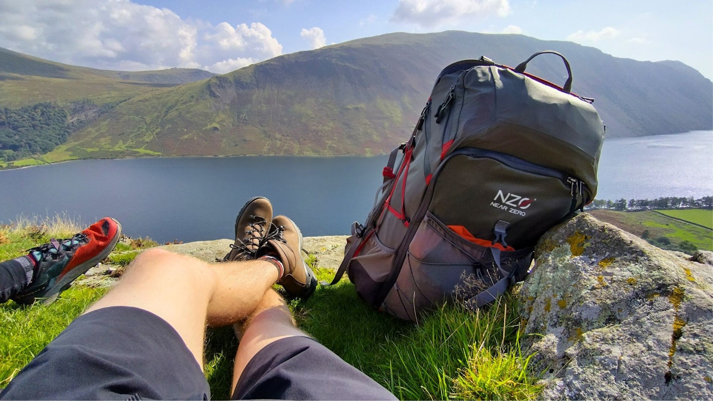 First person view of sitting on a hill with Near Zero hiking backpack