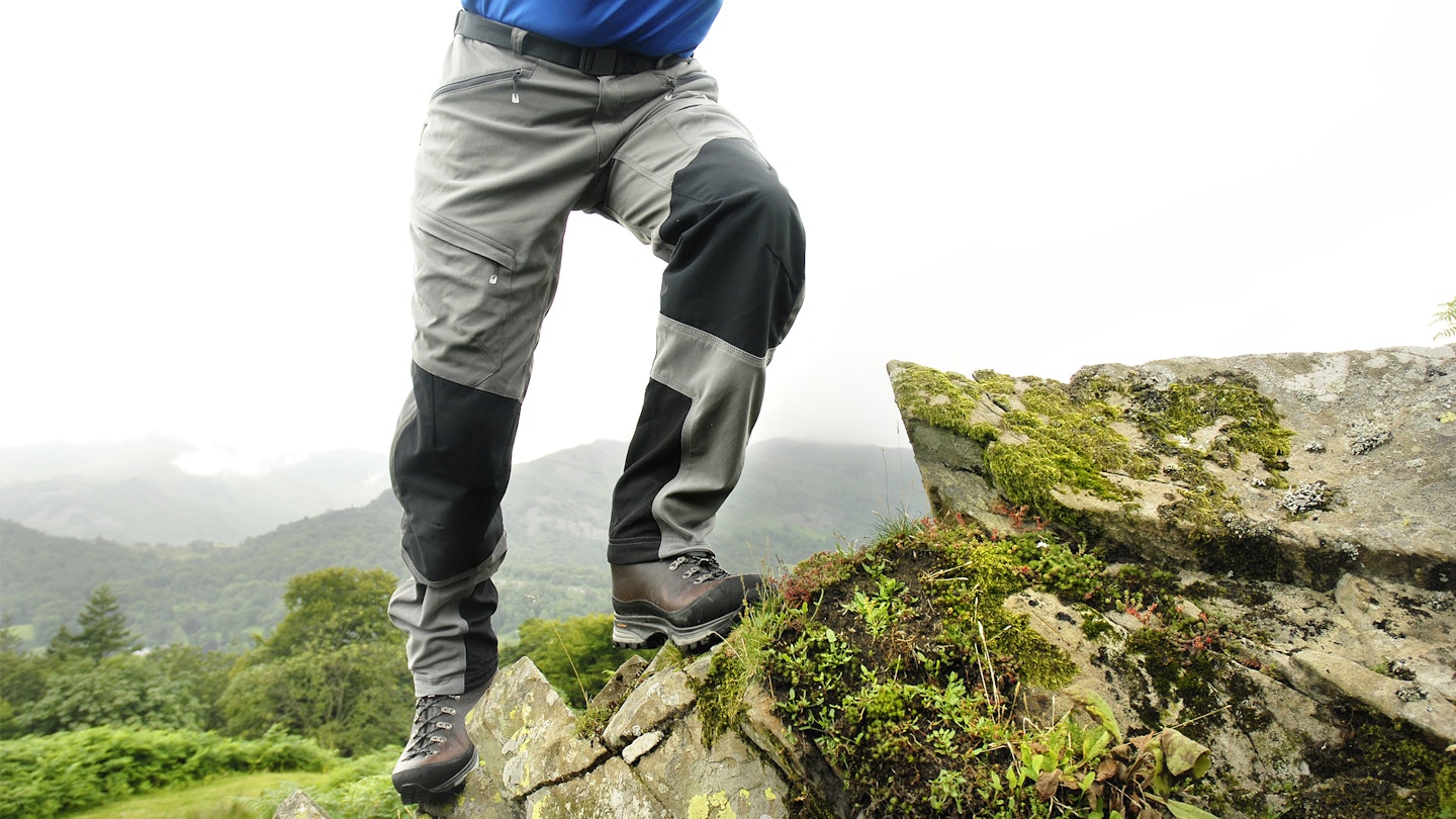 showing off the reinforced knees on these hiking trousers