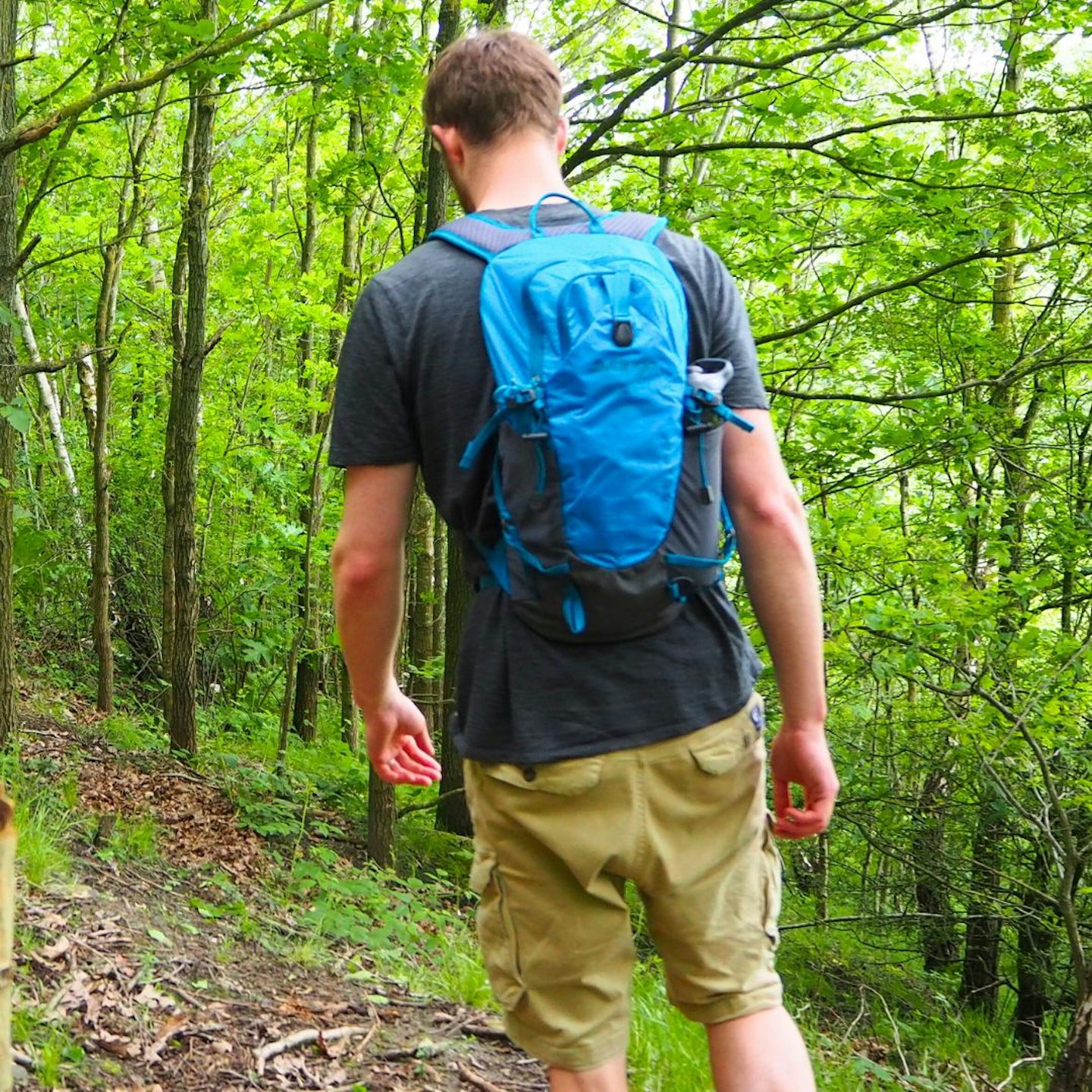 Hiker walking wearing Vango Apex 20