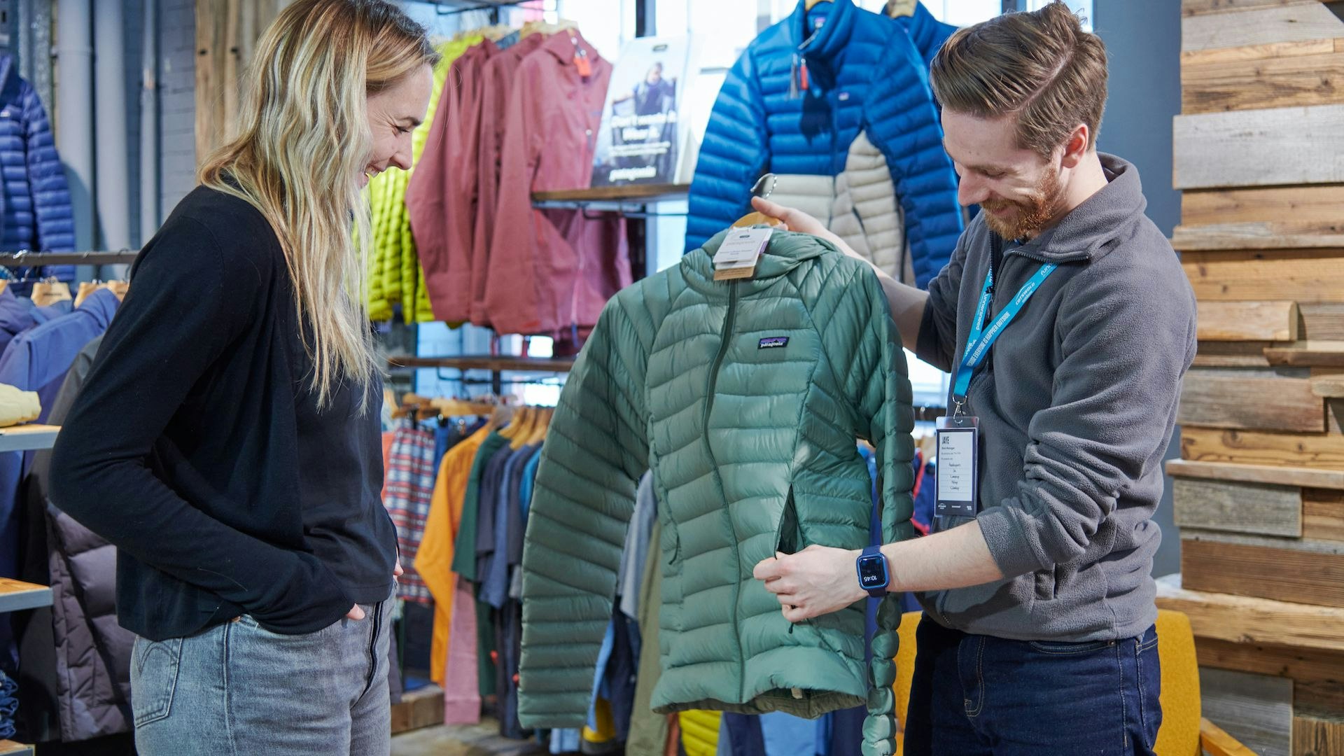 Getting advice on buying a hiking jacket in an outdoor store