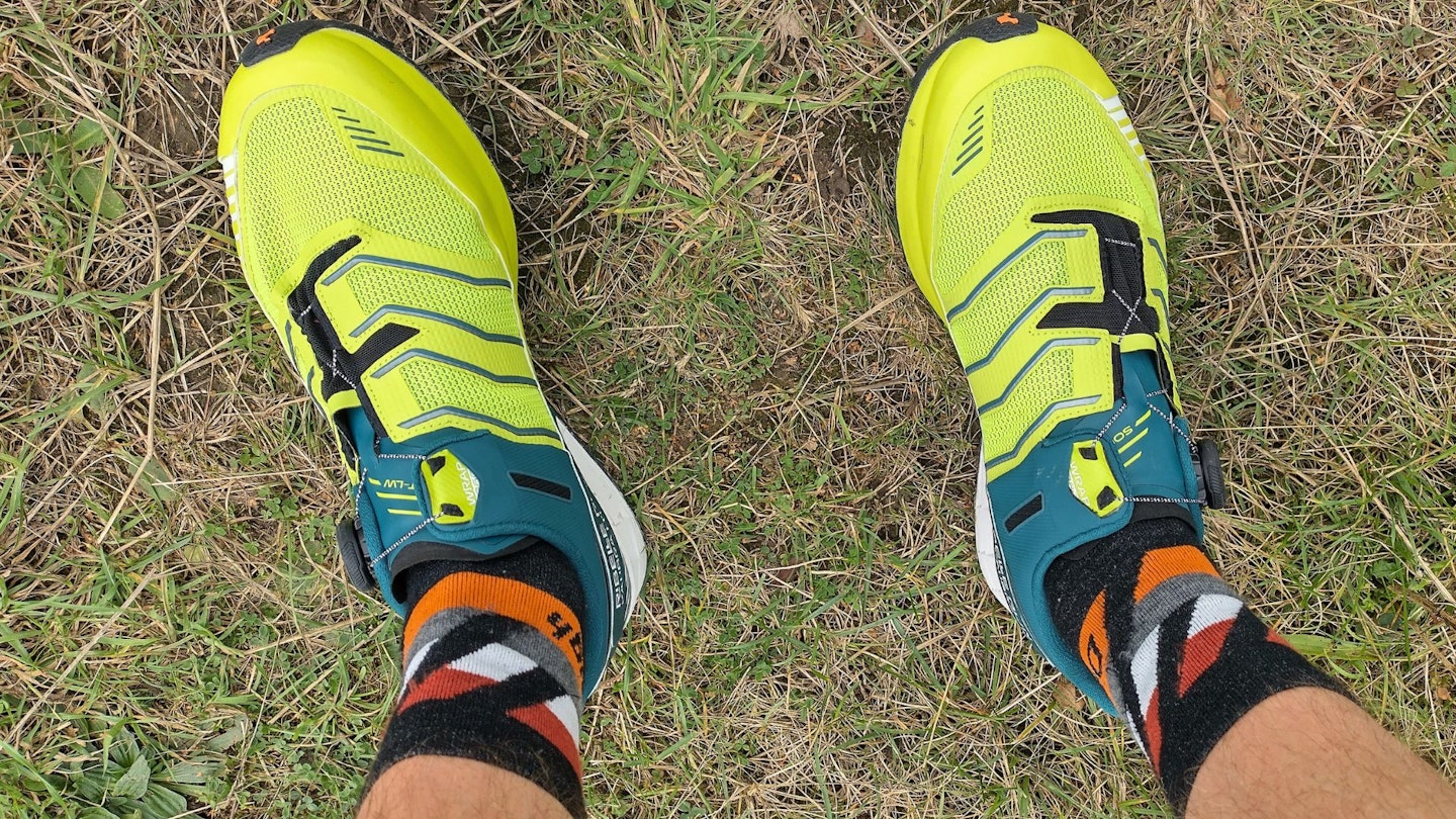 First person view looking down at feet wearing Scarpa Ribelle Run Kalibra HT