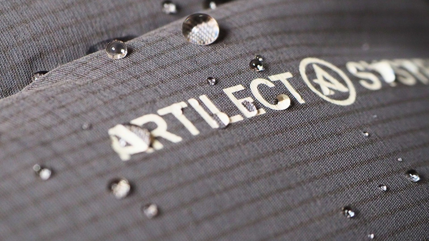 Macro shot of water droplets sitting on Artilect fabric