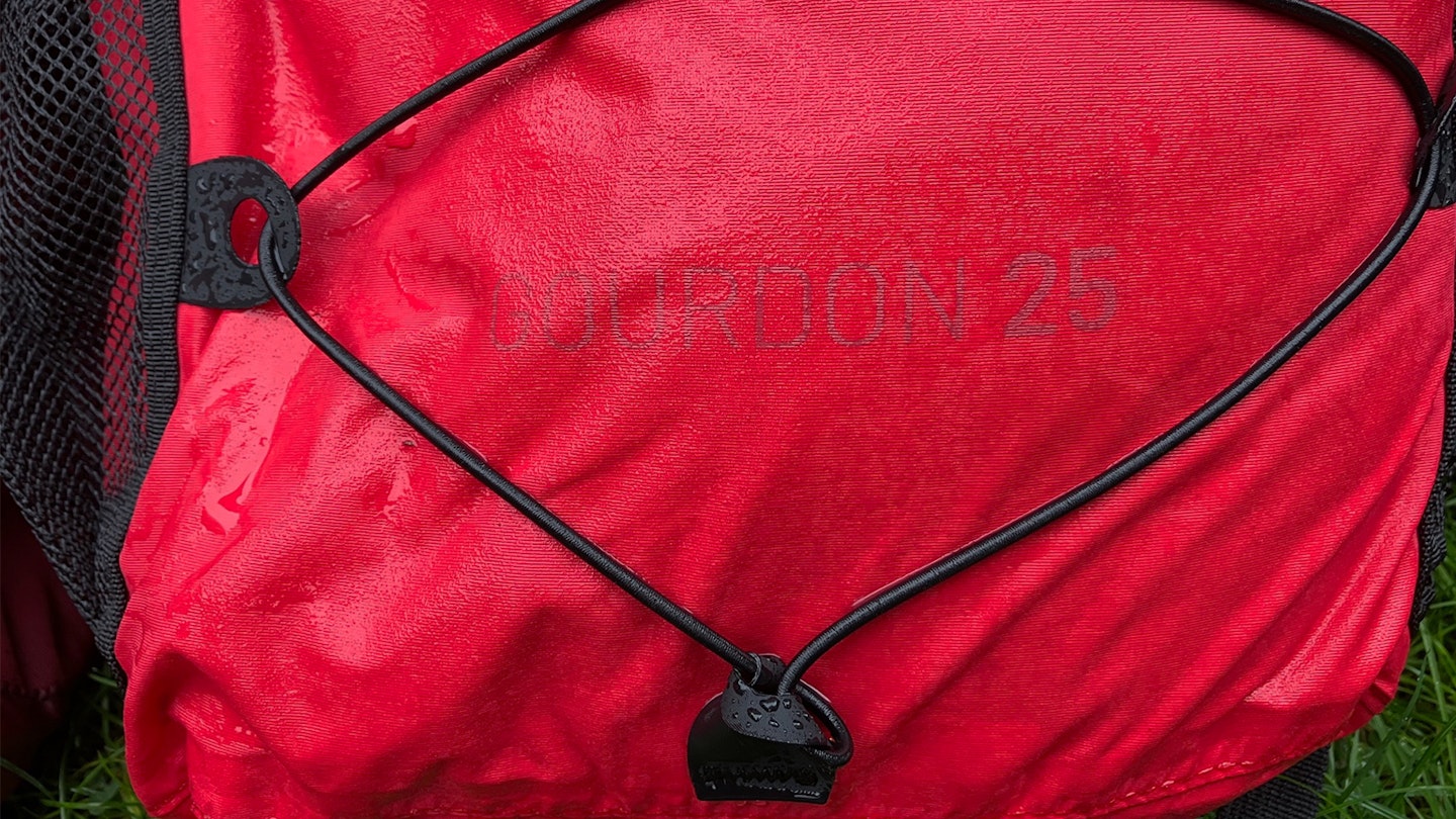 Alpkit Gourdon waterproof backpack being tested in Storm Babet