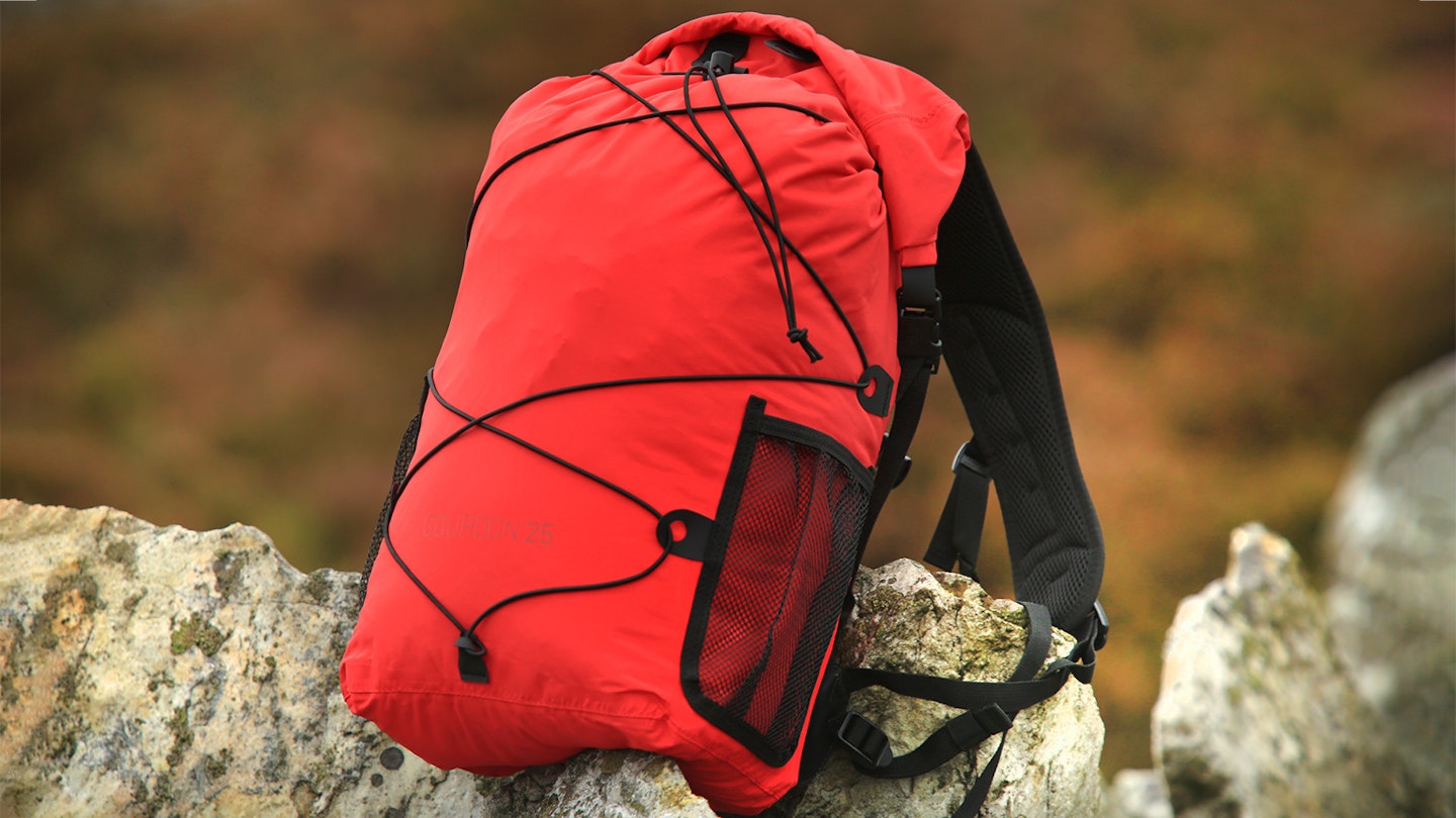 Alpkit Gourdon waterproof backpack on the rocks
