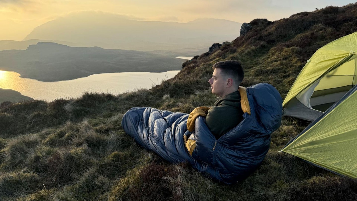 Backpacker testing sleepig bags in the mountains