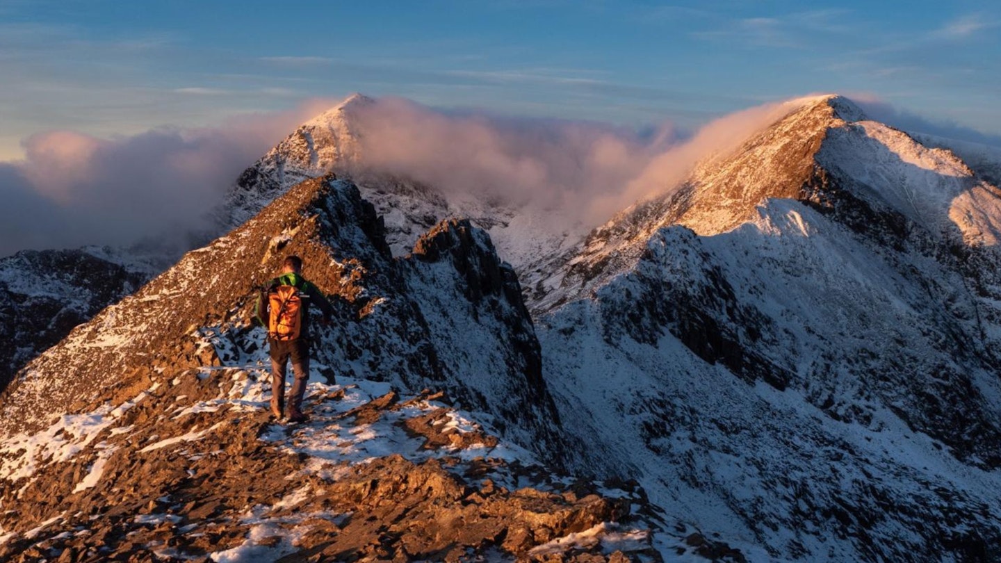 Walker on Snowdon's Crib Goch ridge in winter