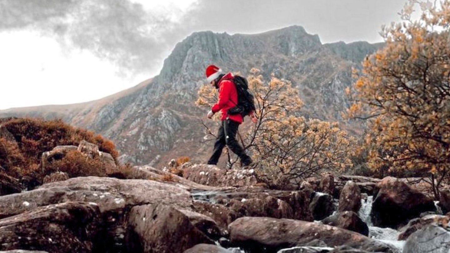 Hiker in Santa hat