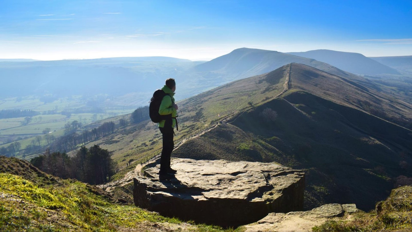 Walker looking back along the Great Ridge to Mam Tor, Peak District