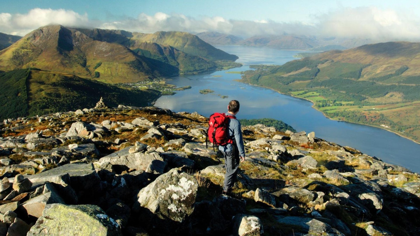 Walker looking over Loch Leven from the Pap of Glencoe