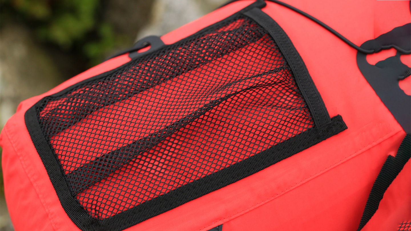 Mesh side pocket of the Alpkit Gourdon waterproof backpack