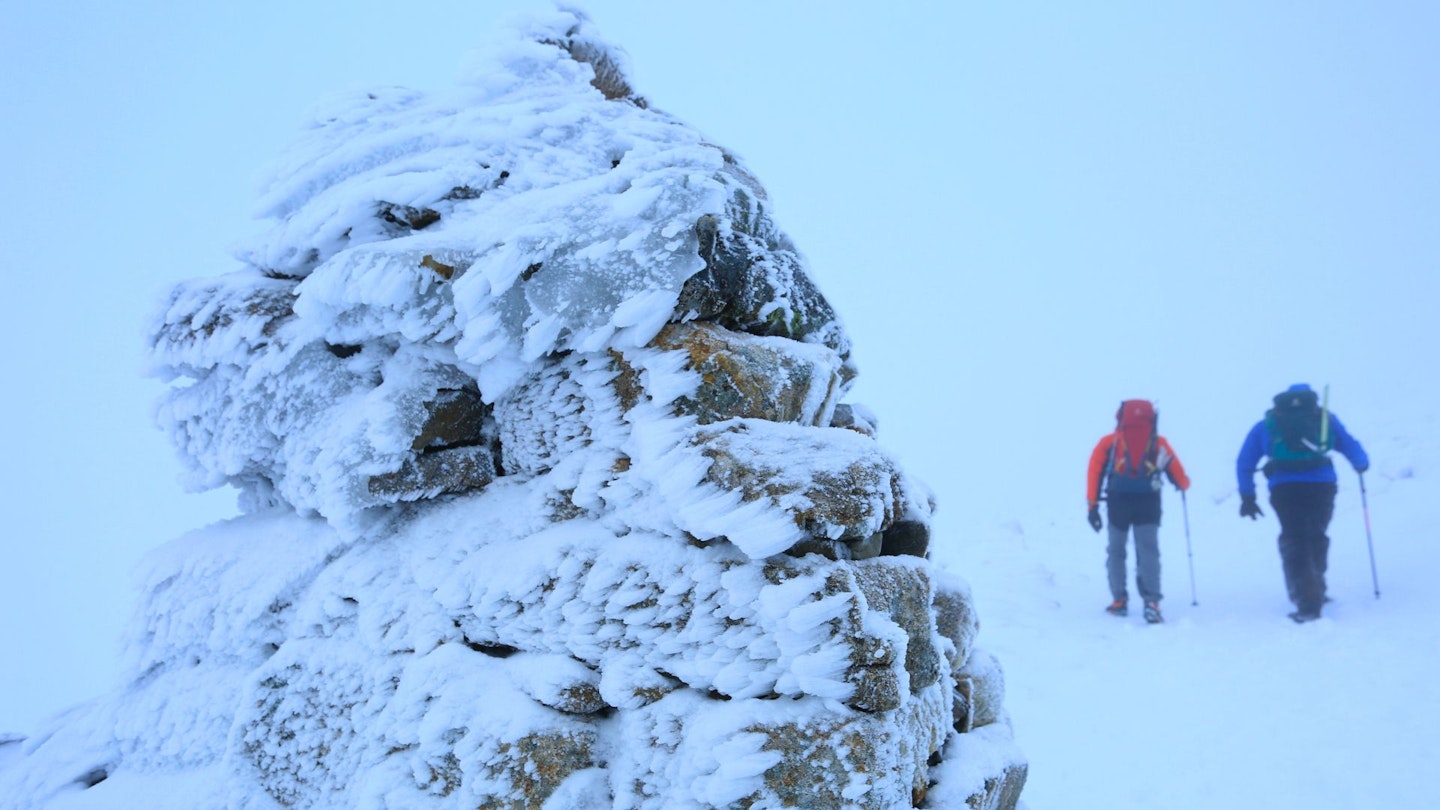 Passing navigation cairn on the way down from Ben Nevis summit plateau