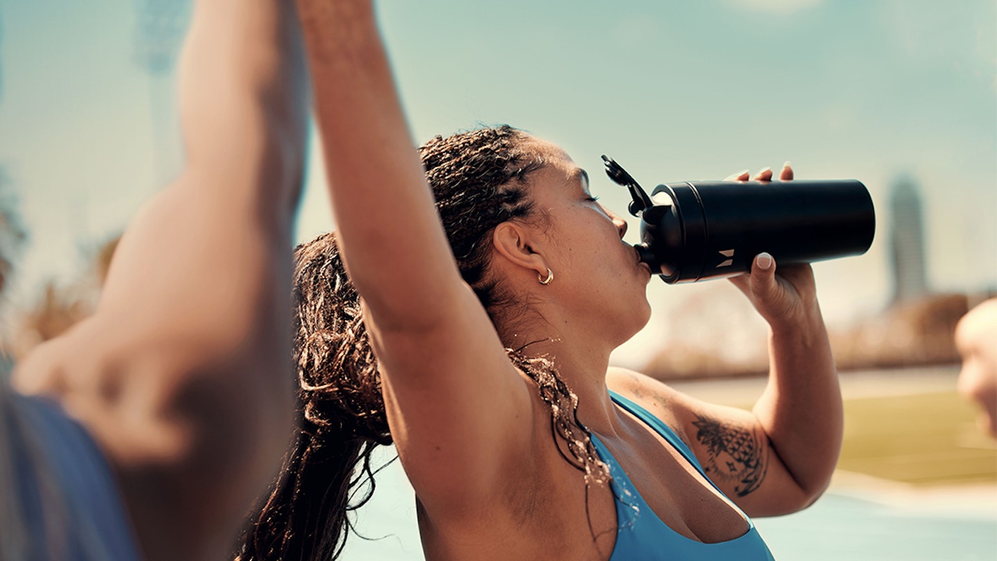 runner drinking protein shake