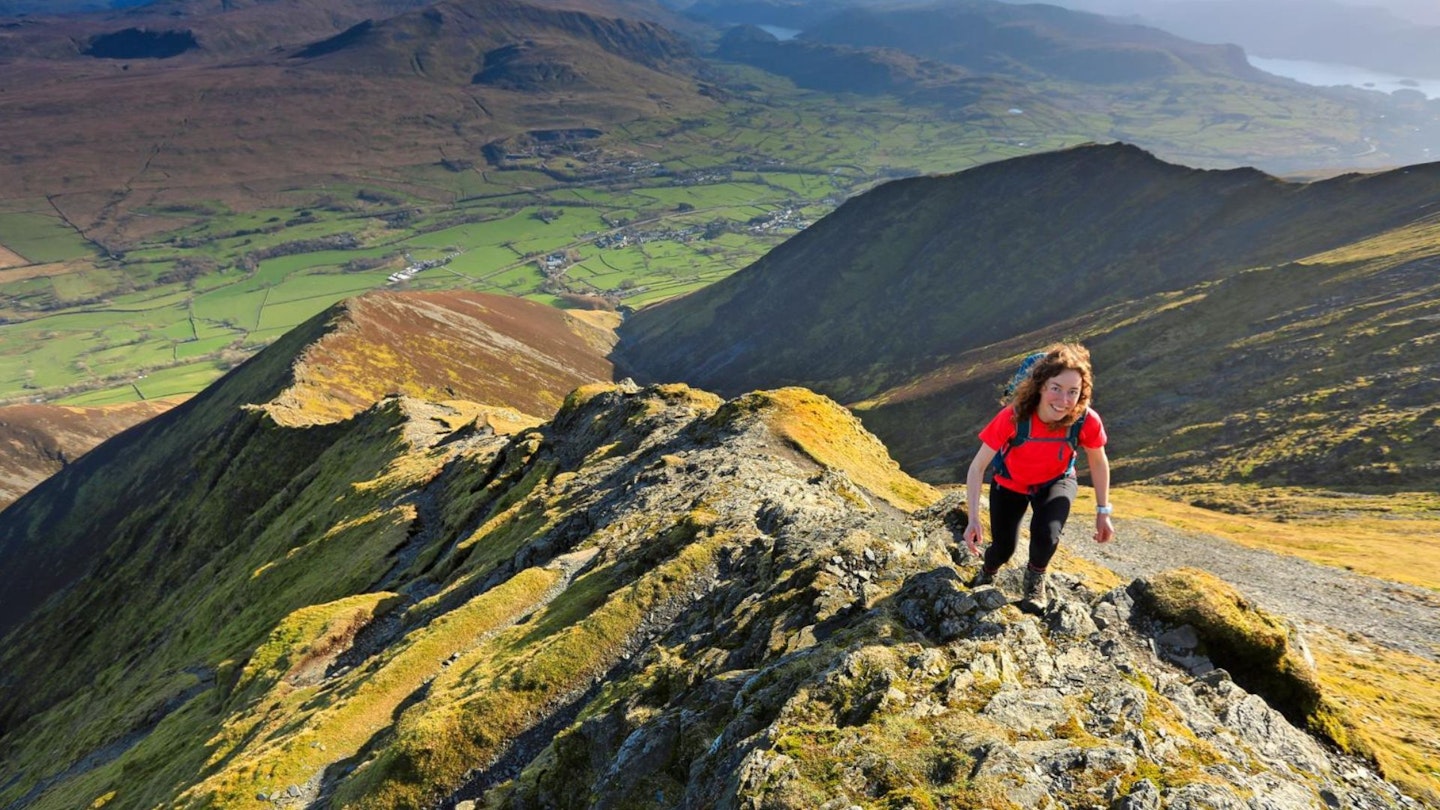 Female walker high on Blencathra's Hall's Fell Ridge