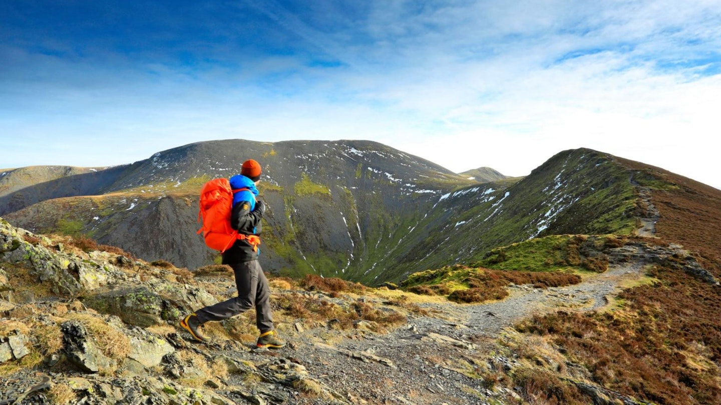 Walker looking to Skiddaw from Longside Edge