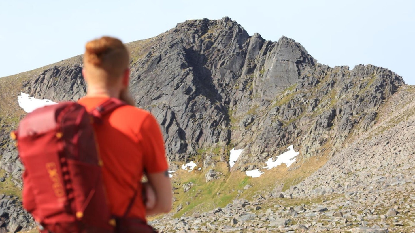 Hiker sizing up the Fiacaill Ridge, Cairn Gorm, Cairngorms