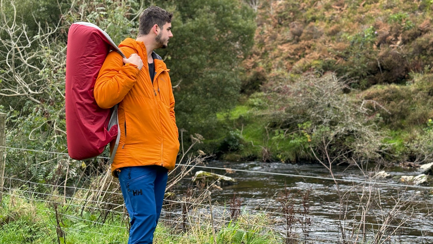 carrying the large packed exped camping mattress