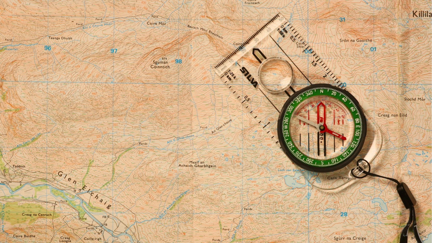 Detailed shot of a map and compass